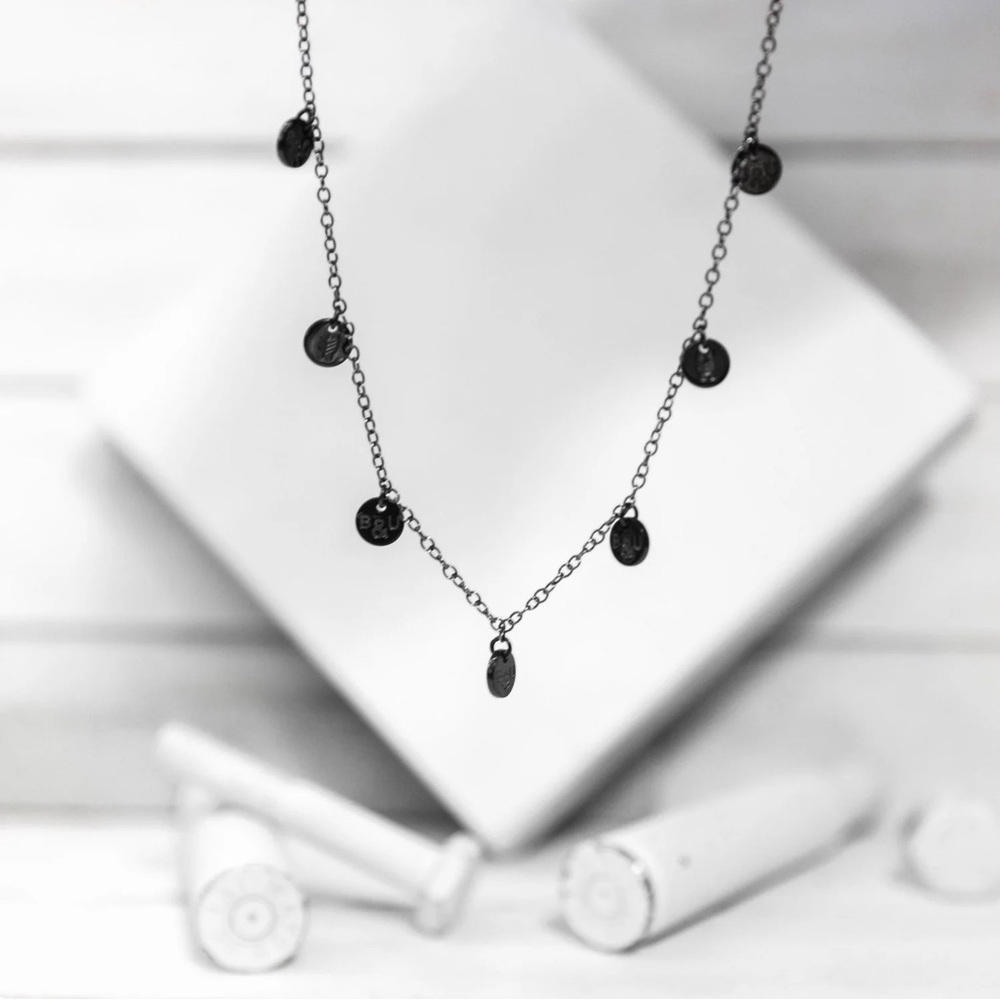 BRASS AND UNITY TITANIUM MULTI CHARM NECKLACE BLACK New in Box